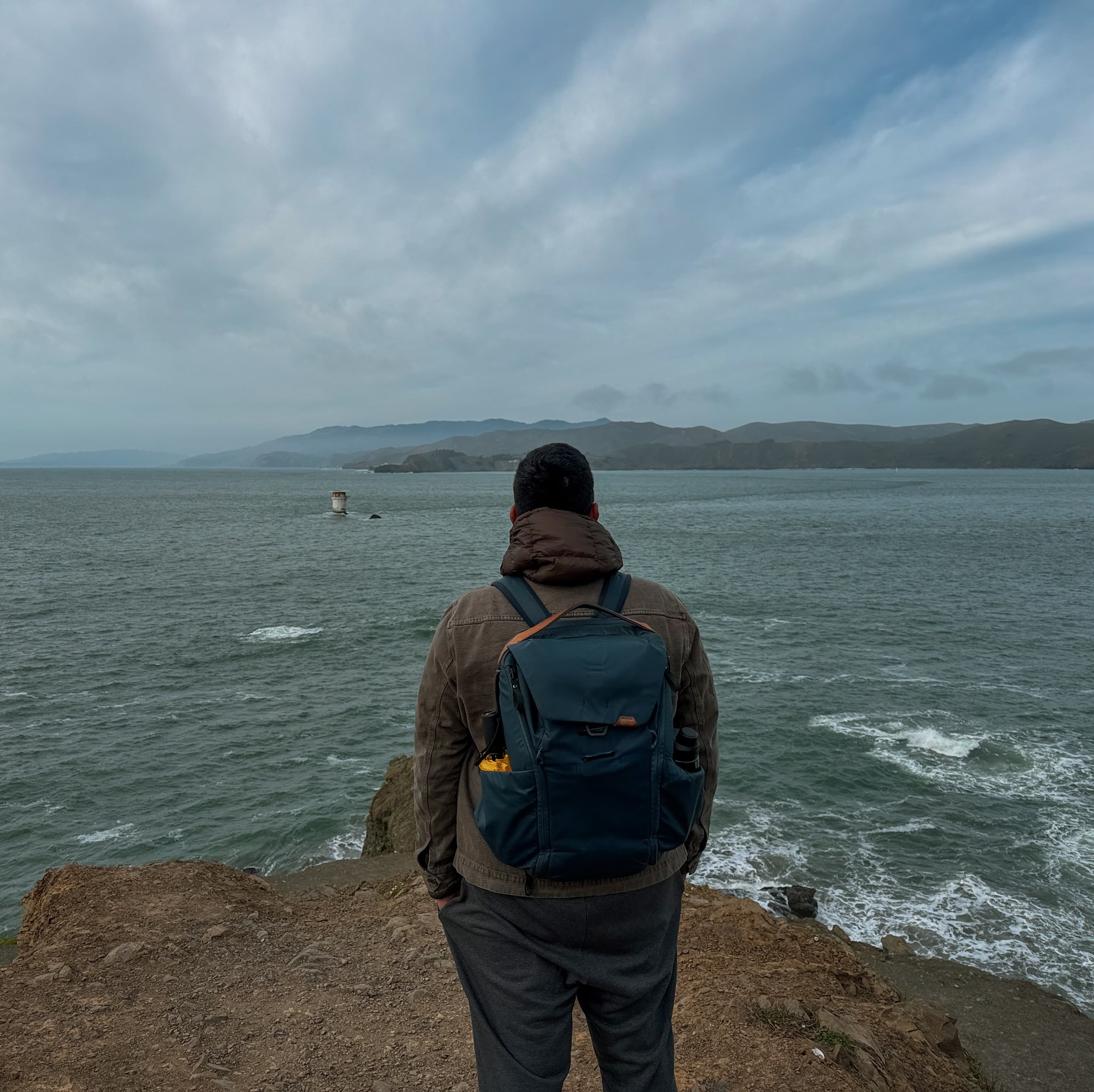 Nishant Jha looking out over the water